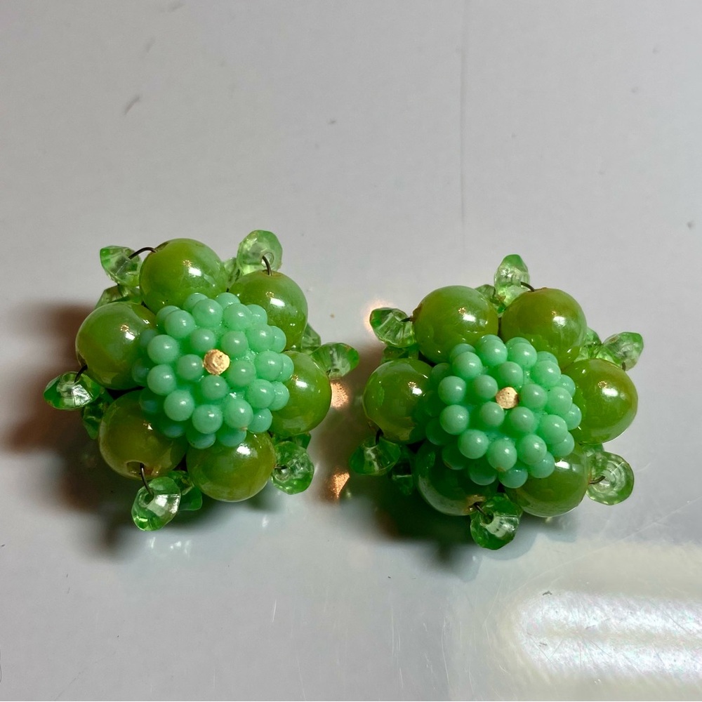Vintage clip green earrings marked Hong Kong.